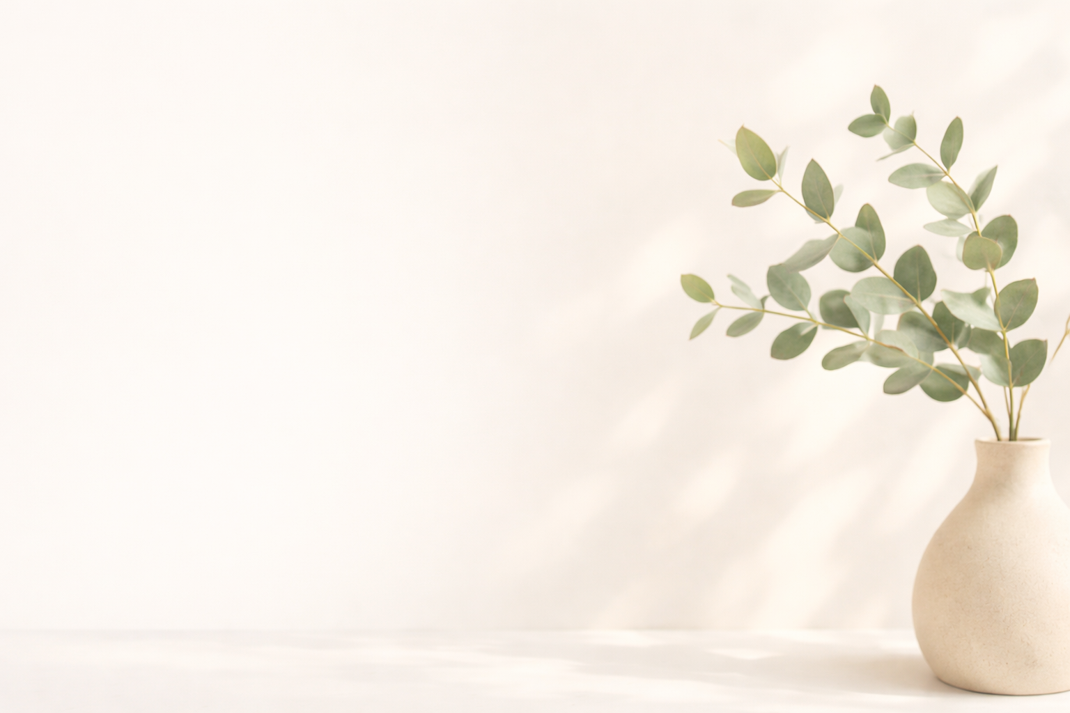Eucalyptus stems in a ceramic vase